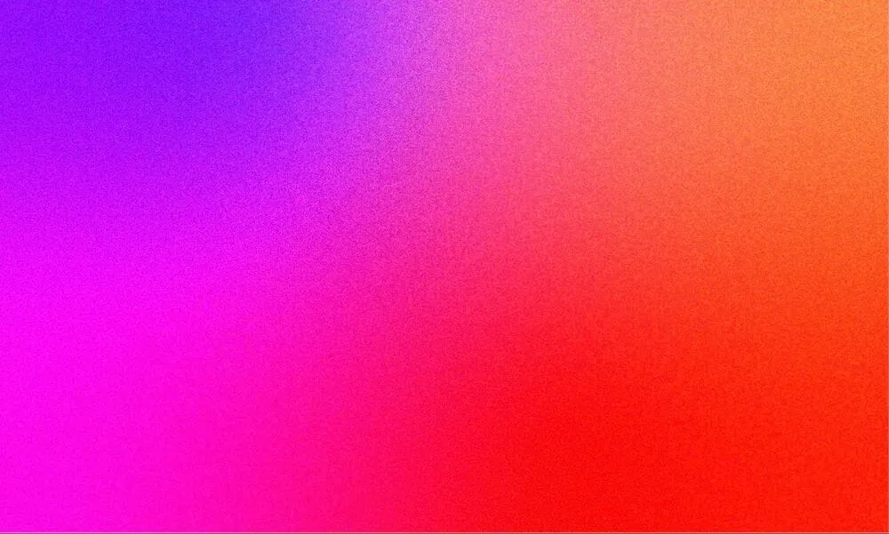 A grainy gradient made of purple, pink, orange, and red.